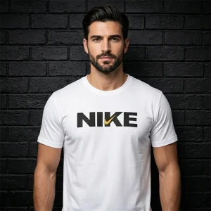 Classic Nike white t-shirt for men with black logo and golden swoosh on a dark brick wall background.